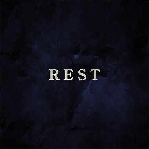An airy, cloudy and colored background with the word "REST" in the foreground.